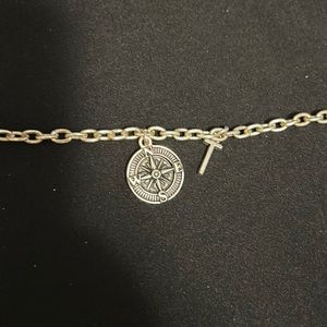 Silver bracelet with compass and letter T